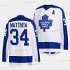 Toronto Maple Leafs #34 Auston Matthews Valkoinen Klassinens Primary Logo Ommeltu Paita – Miesten